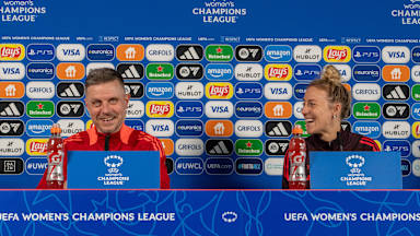Caro Simon and Alex Straus sitting side by side on the podium during the press conference
