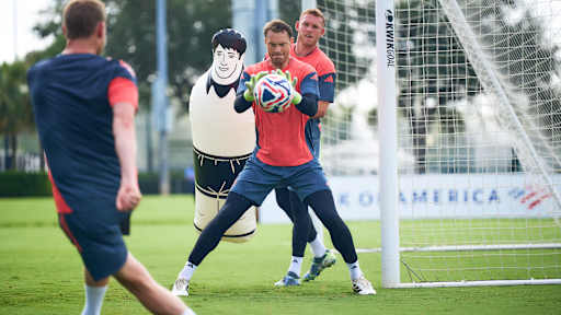 Manuel Neuer holding the ball during goalkeeper training