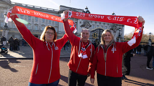 FC Bayern fans hold up scarves in front of Buckingham Palace