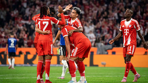 Luis Díaz and Michael Olise celebrate after FC Bayern's 5-0 victory over Hamburger SV in the Bundesliga.