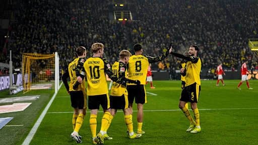 Borussia Dortmund players celebrate after a goal in the Bundesliga