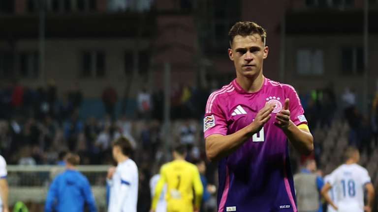 Joshua Kimmich applauds after Germany's win in Bosnia and Herzegovina