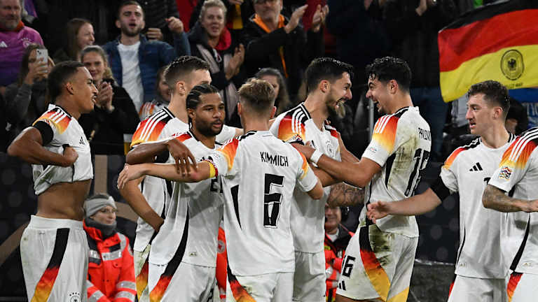 The Germany players celebrate the winner against the Netherlands.