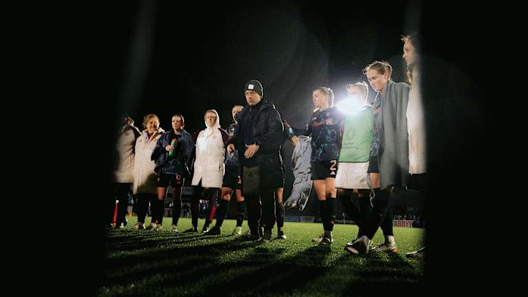 Alexander Straus during his team talk after the match against Arsenal with the players in a circle around him.