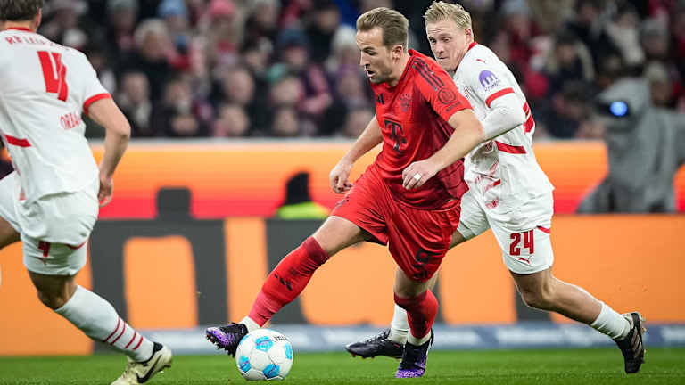 Harry Kane in a duel with Xaver Schlager in the Bundesliga match between FC Bayern against RB Leipzig