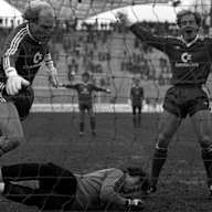 Dieter Hoeneß (FC Bayern München) scores the goal against goalkeeper Carsten Hallmann (1. FC Saarbrücken) to make it 2:1, Michael Rummenigge (FC Bayern München) celebrates