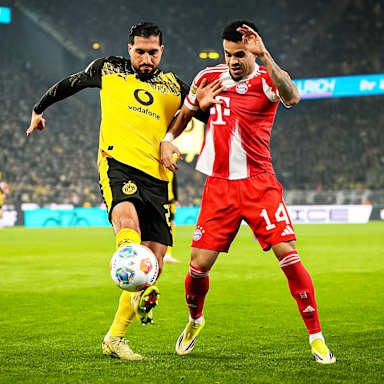 Luis Díaz im Zweikampf mit Emre Can während des Bundesliga-Topsspiels des FC Bayern bei Borussia Dortmund