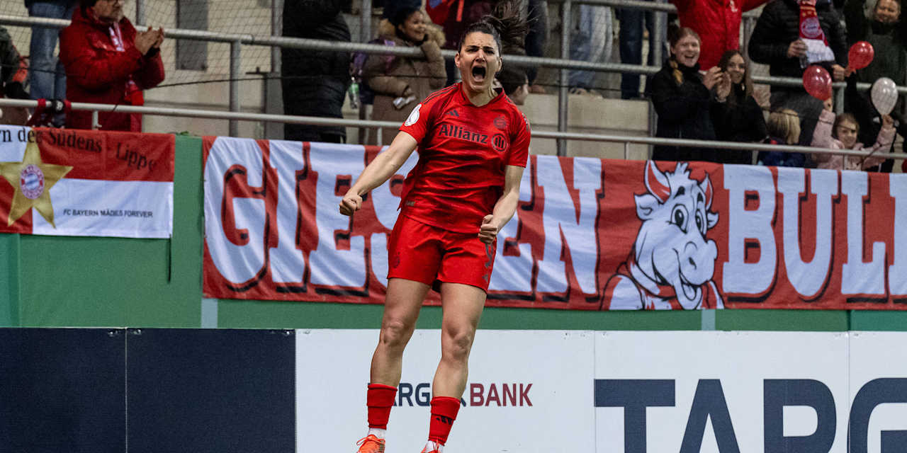 Jovana Damnjanović jumps in the air in celebration after her goal.