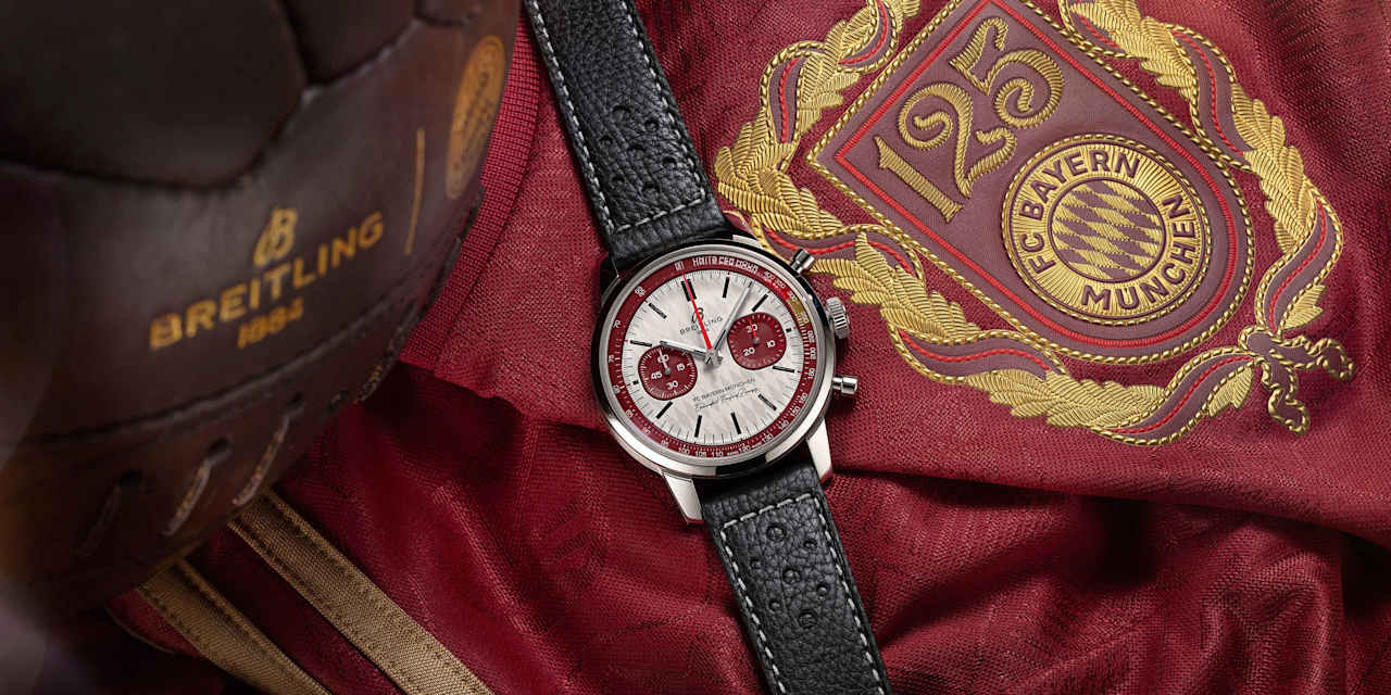 Breitling watch 'Top Time B01 125 Years FC Bayern München Limited Edition' resting on a maroon FC Bayern anniversary jersey