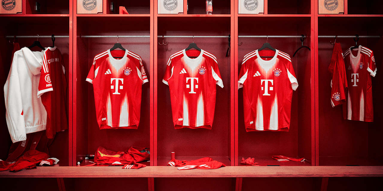 FC Bayern's new home jersey in red and white with a stylised M hanging in the dressing room