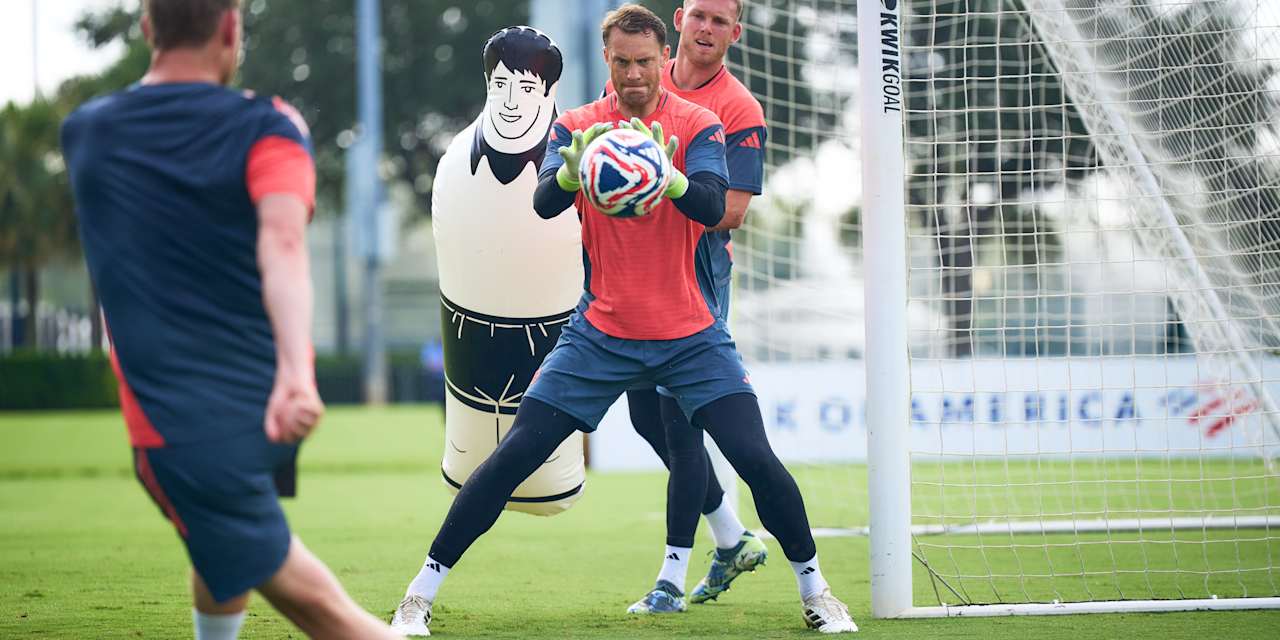 Manuel Neuer holding the ball during goalkeeper training