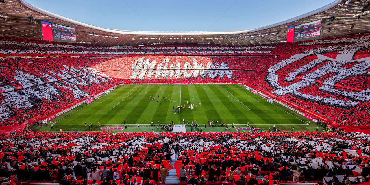 Tifo for club's 125th birthday at the Allianz Arena in red and write with the name Bayern München as well as a historic club crest.
