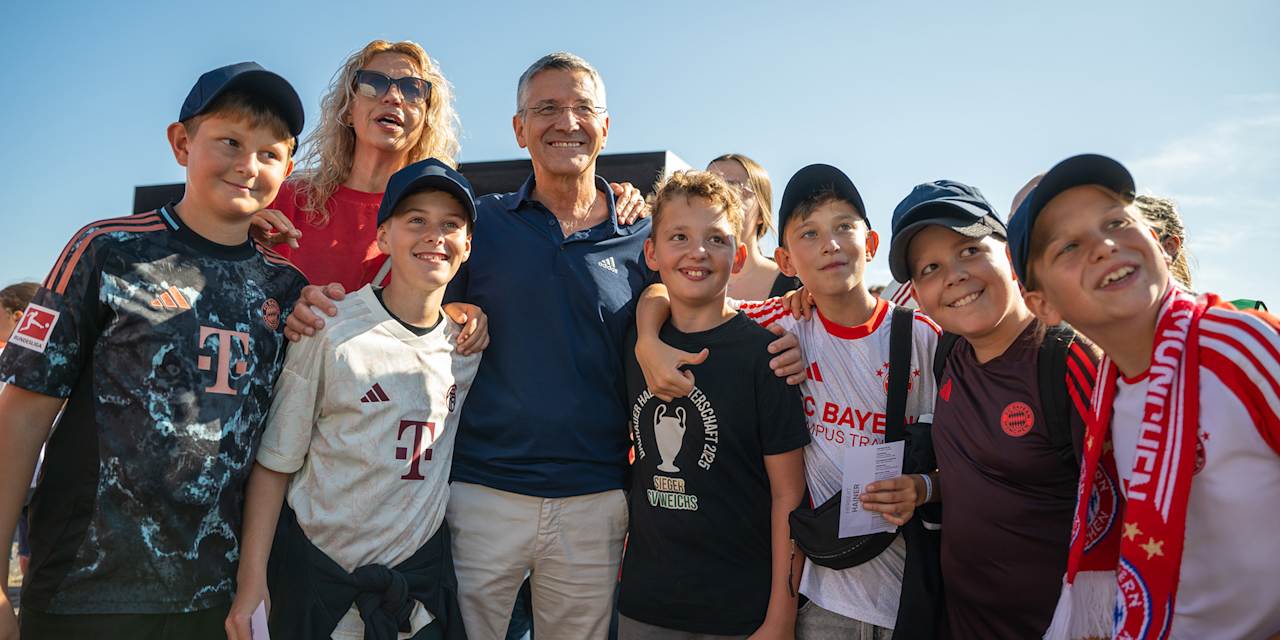 Herbert Hainer surrounded by fans on the esplanade of the Allianz Arena