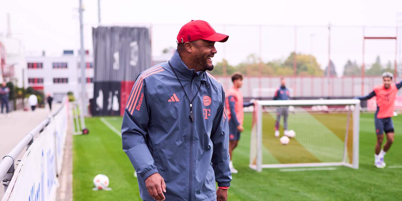 Vincent Kompany laughs during a Bayern training session
