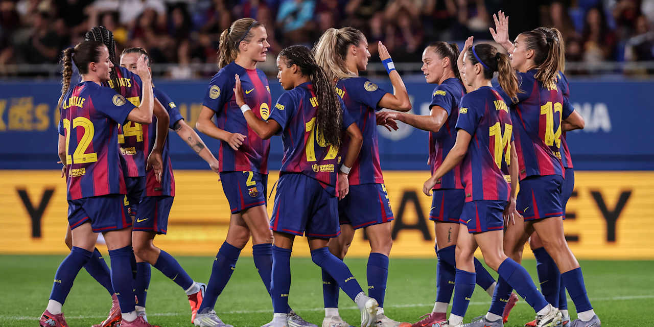 FC Barcelona players celebrate and high-five after a goal