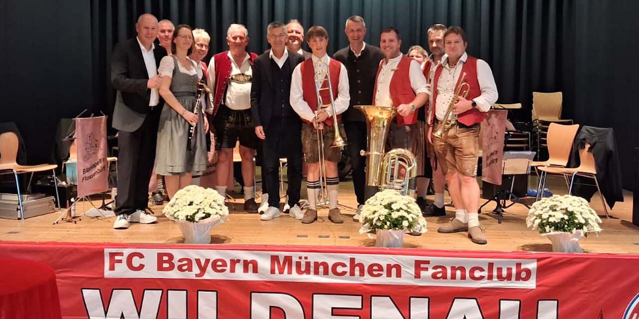 President Herbert Hainer with fans and brass band at the fan club anniversary celebration