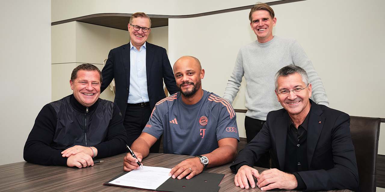 Vincent Kompany signs a contract at FC Bayern in the company of Max Eberl, Jan-Christian Dreesen, Christoph Freund and Herbert Hainer