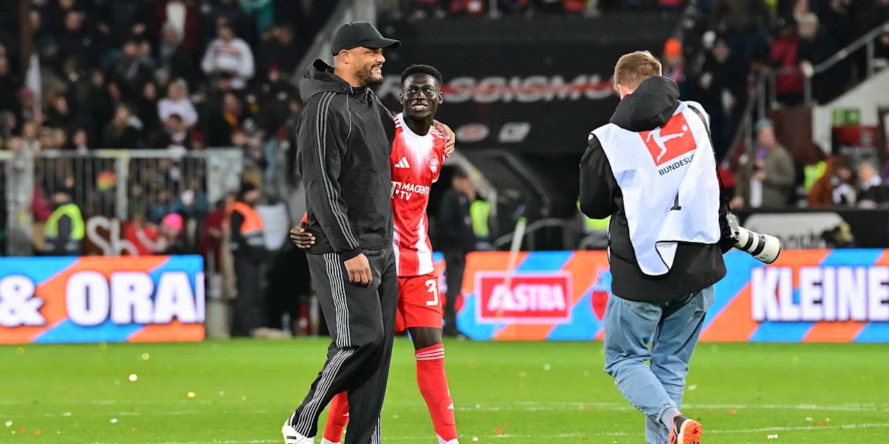 Vincent Kompany und Bara Sapoko Ndiaye nach dem Spiel beim FC St. Pauli