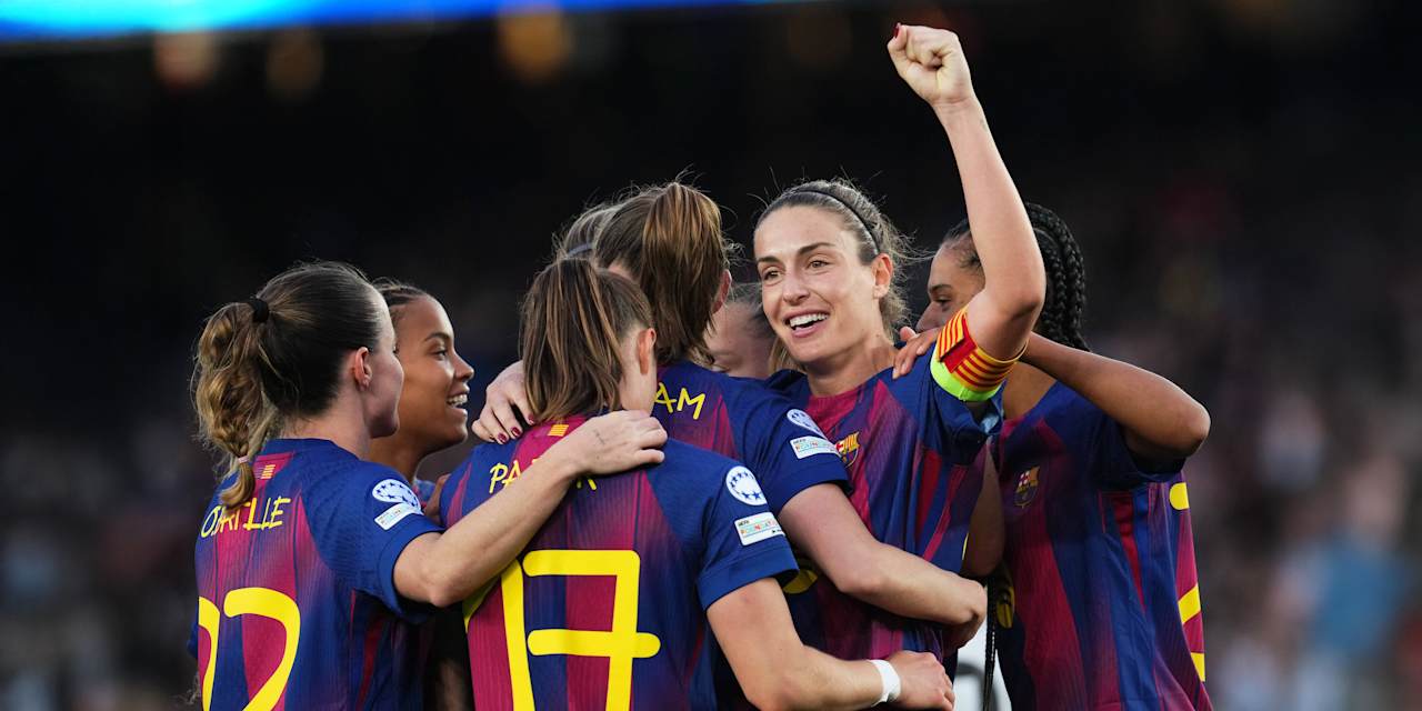 The Barcelona players celebrate after scoring a goal against Real Madrid.