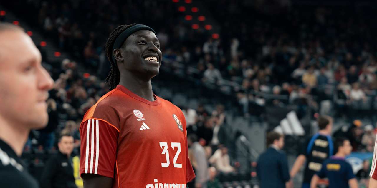 Wenyen Gabriel laughs during warm-ups