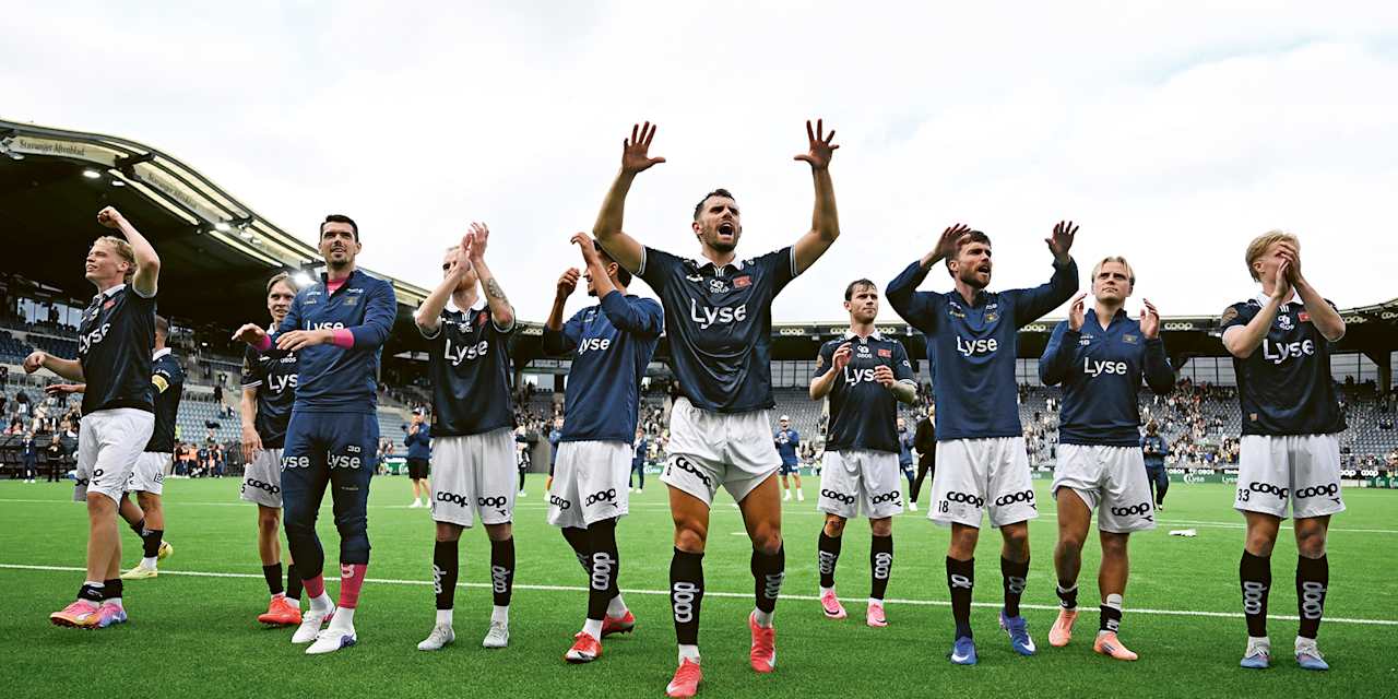 Viking players celebrating and waving to the fans