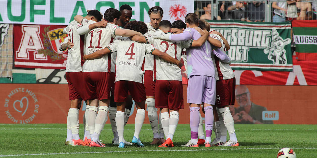 FC Augsburg players in a huddle