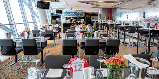 Foyer – several tables set, bar in the foyer, and catering buffet.