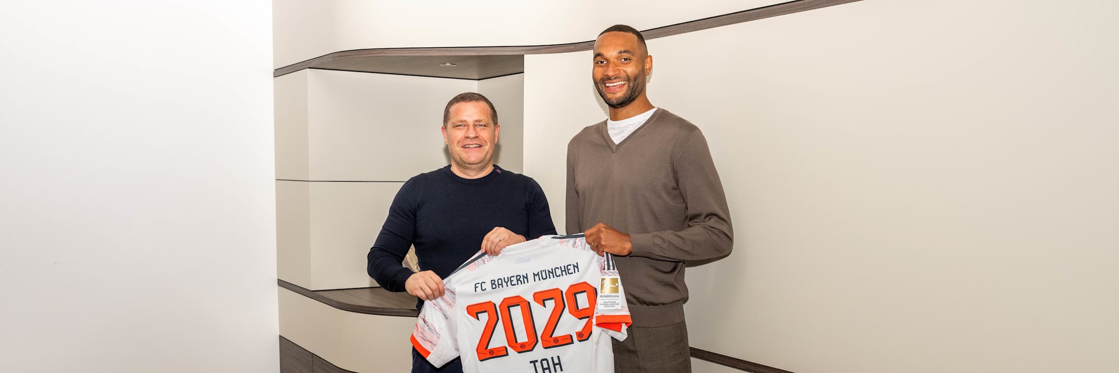 FC Bayern board member for sport, Max Eberl, with Jonathan Tah