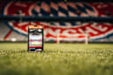 Ein Handy in der Allianz Arena mit der praktischen Allianz Arena App