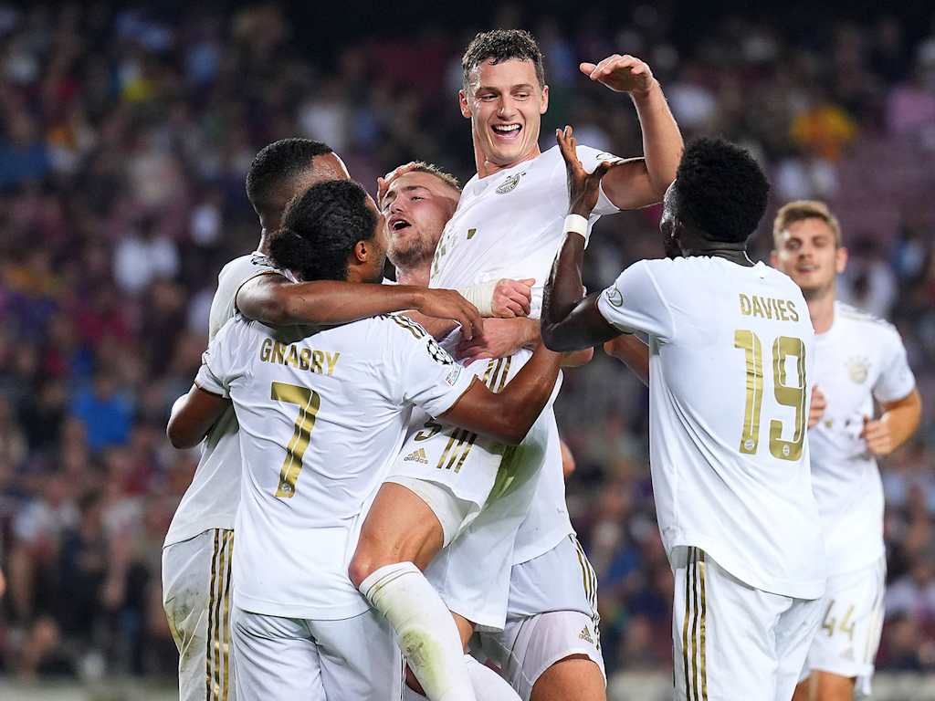 Smells like team spirit: Bayern celebrate victory in Barcelona.