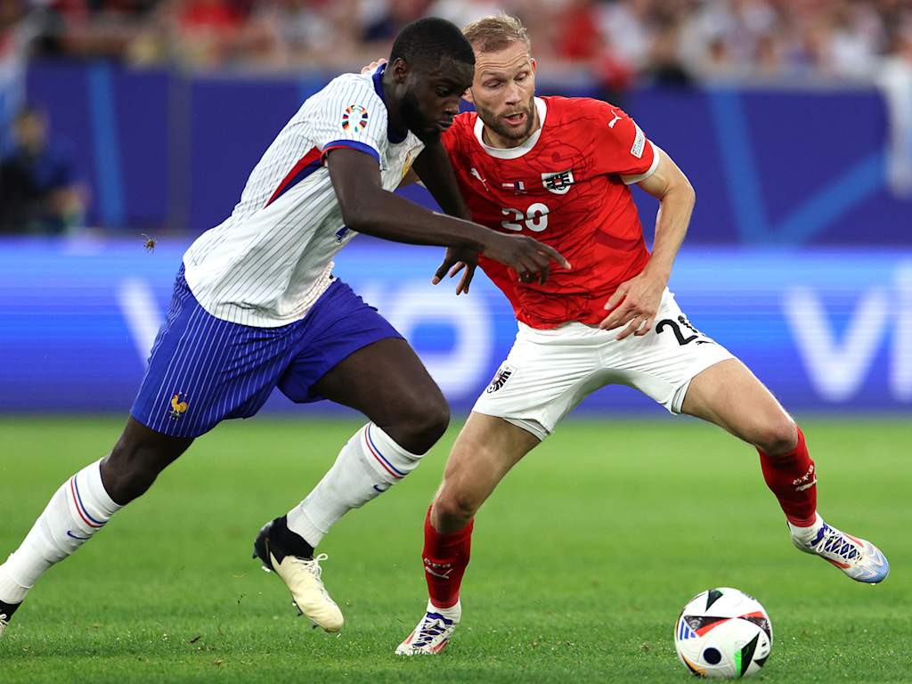 Bayern's Dayot Upamecano and Konrad Laimer in a tussle during the European Championship match between Austria and France.