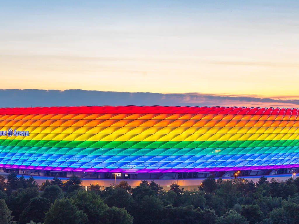 FC Bayern's Allianz Arena lights up in the rainbow colours in the evening hours.