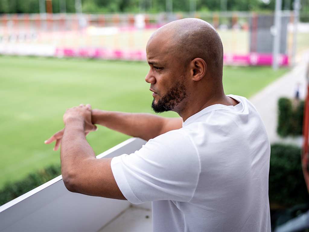 New coach Vincent Kompany views the FC Bayern training ground from a balcony.