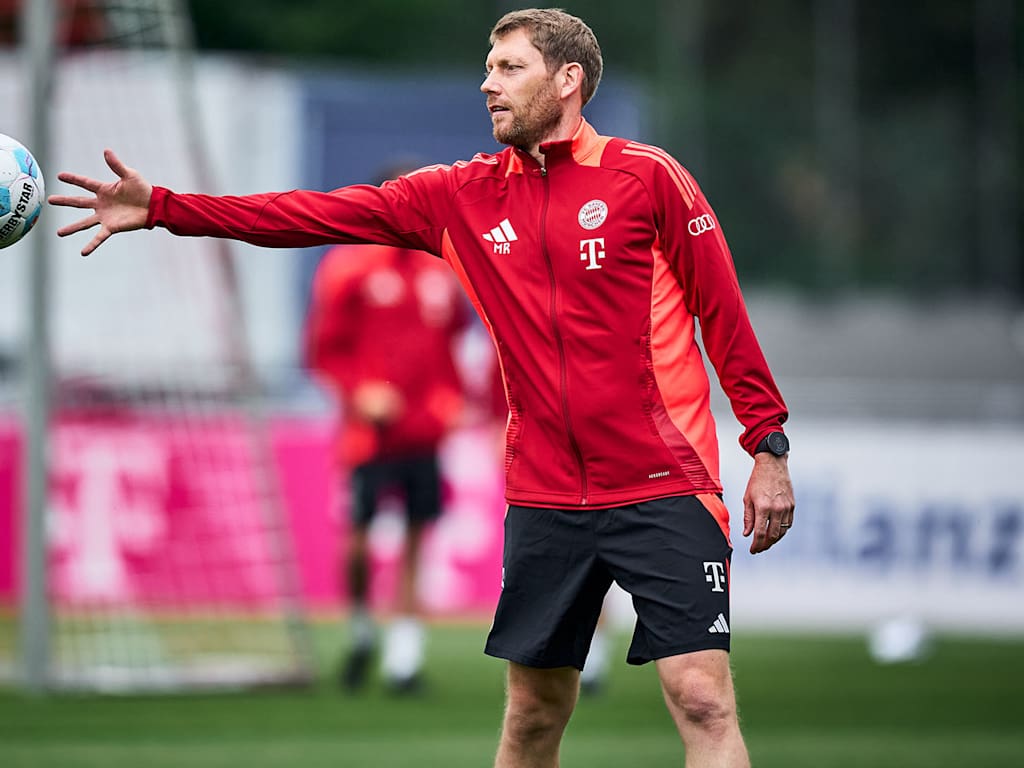 Goalkeeping coach Michael Rechner catches a ball during FC Bayern training