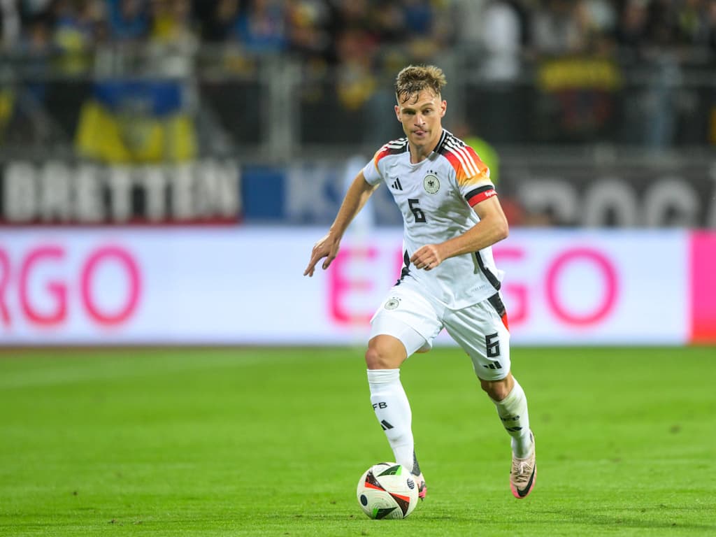 Joshua Kimmich on the ball, wearing the Germany jersey and the captain's armband.