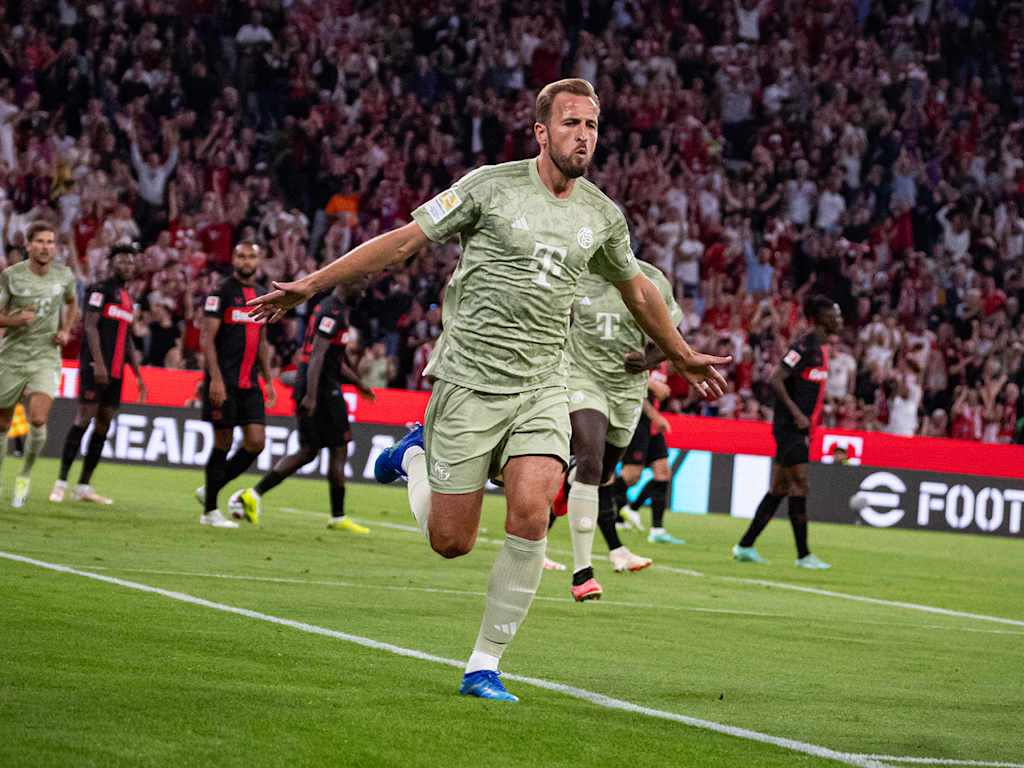 Harry Kane of FC Bayern celebrates his goal against Bayer 04 Leverkusen