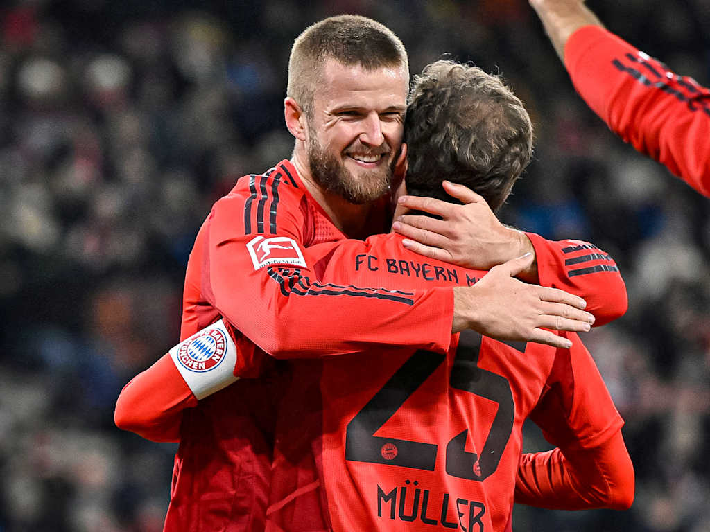 Eric Dier celebrates his headed goal to make it 1-0 alongside Thomas Müller