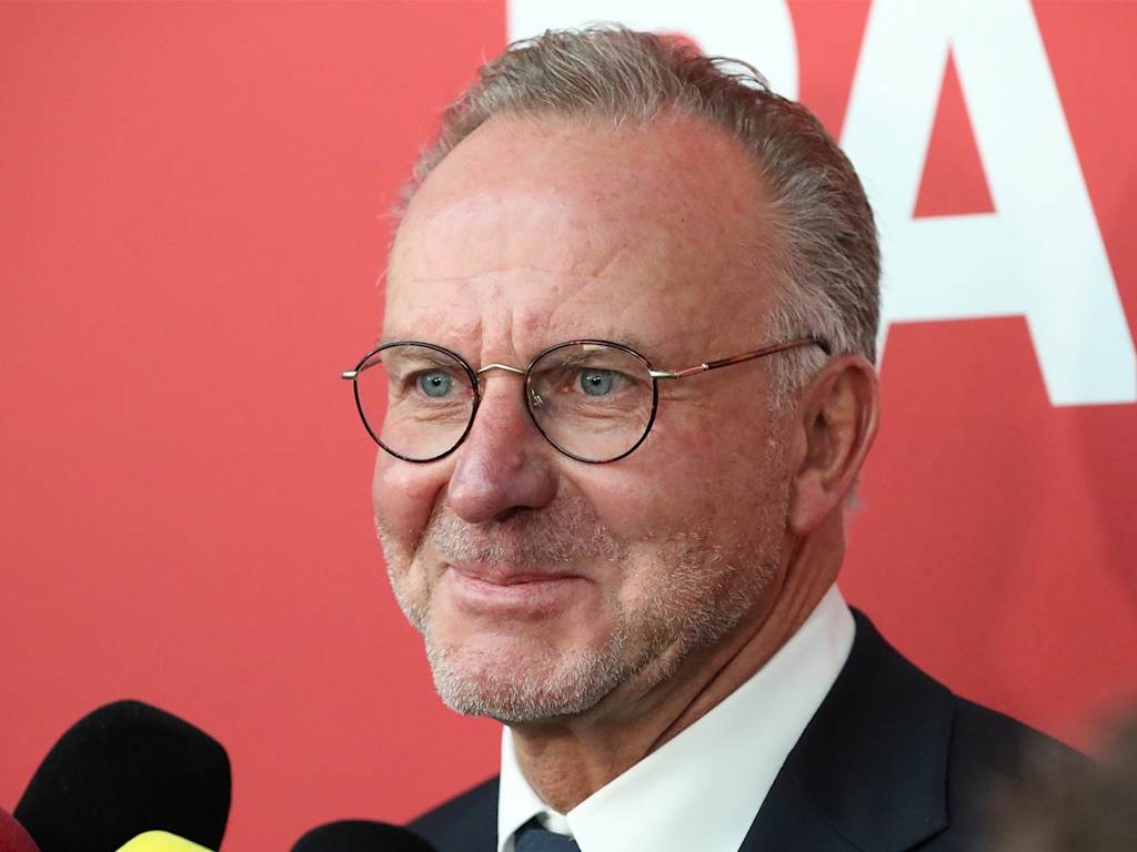 Portrait of Karl Heinz-Rummenigge smiling during an interview with representatives of the media.