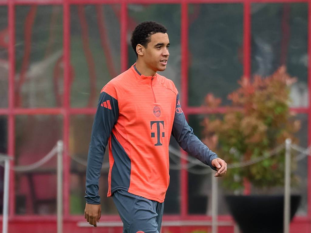 Jamal Musiala smiles on the training pitch