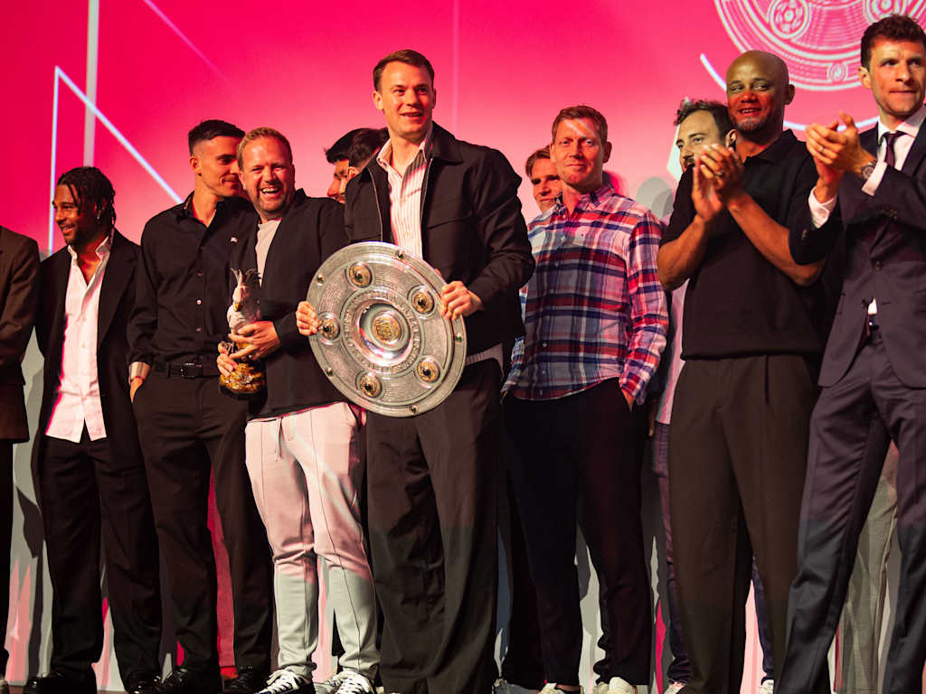 The FC Bayern men's team celebrate with their trophies