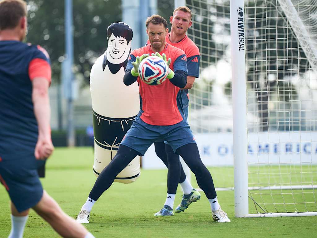 Manuel Neuer holding the ball during goalkeeper training