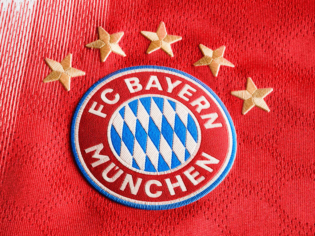 The FC Bayern badge against a red background