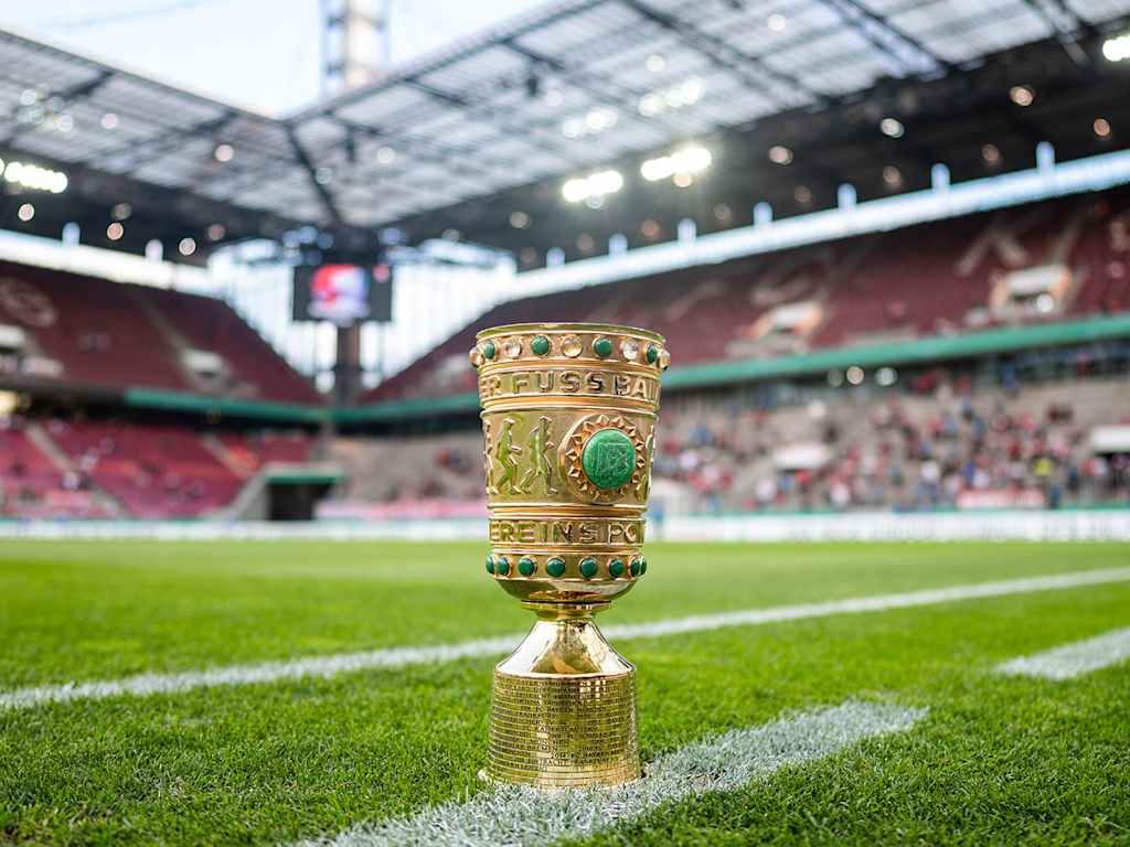 The DFB Cup at the edge of the pitch at Cologne's stadium.