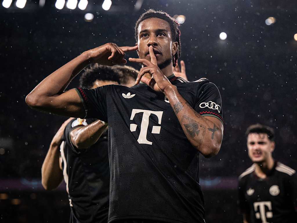 Michael Olise puts his finger to his mouth in celebration in FC Bayern's cup match at Köln