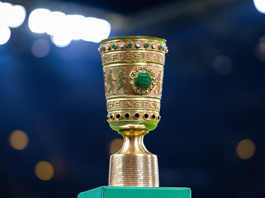 The DFB Cup trophy standing on a plinth in the stadium