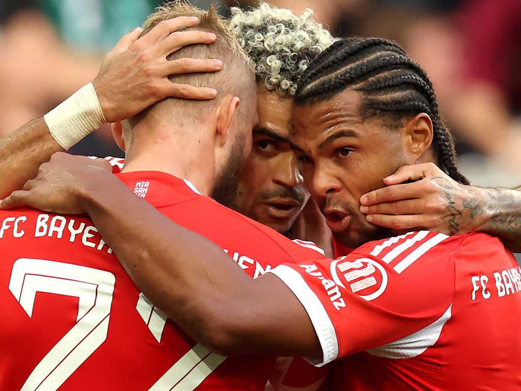 Laimer, Diaz and Gnabry celebrate the second goal together in FC Bayern's Bundesliga match against FC Augsburg.
