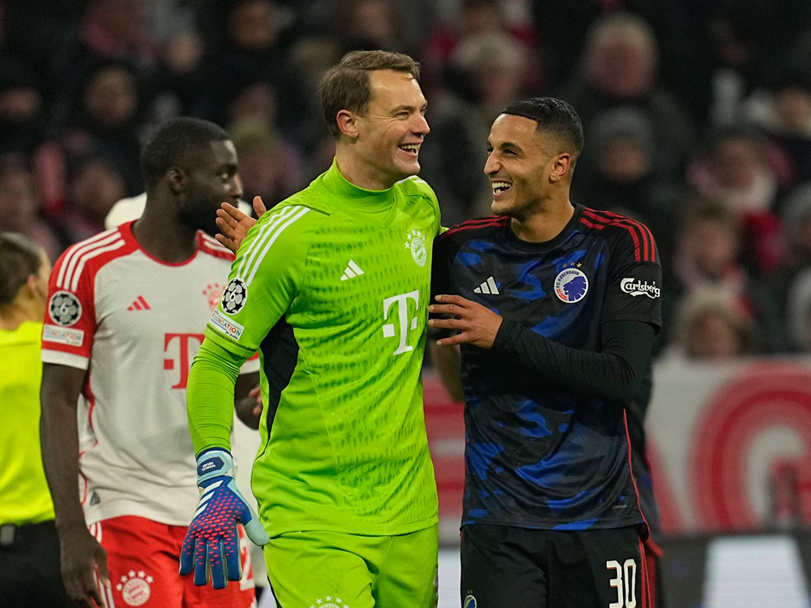 Manuel Neuer shares a smile with his Copenhagen counterpart after their Champions League meeting ending goalless.