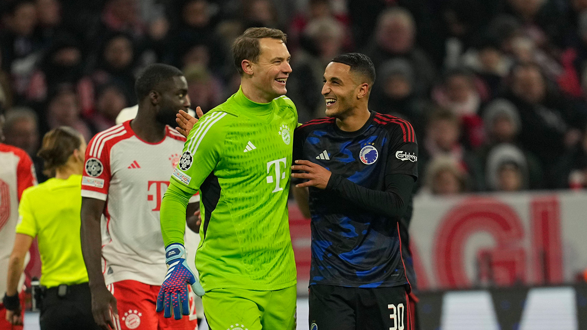 Manuel Neuer shares a smile with his Copenhagen counterpart after their Champions League meeting ending goalless.