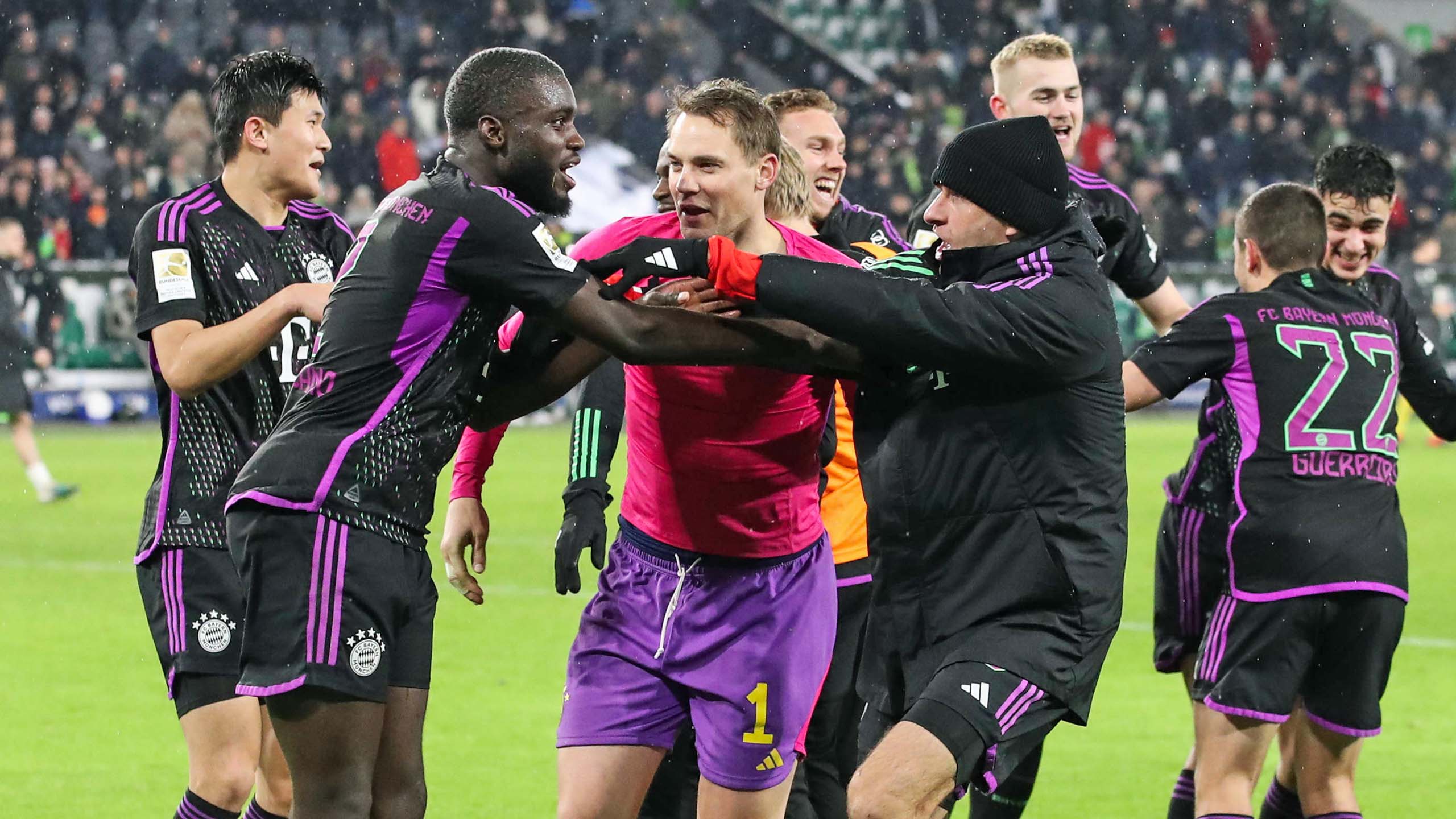 Thomas Müller leads the celebrations after Bayern's win in Wolfsburg.