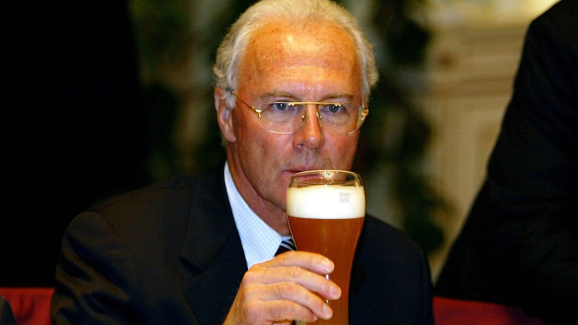 Franz Beckenbauer drinks a wheat beer